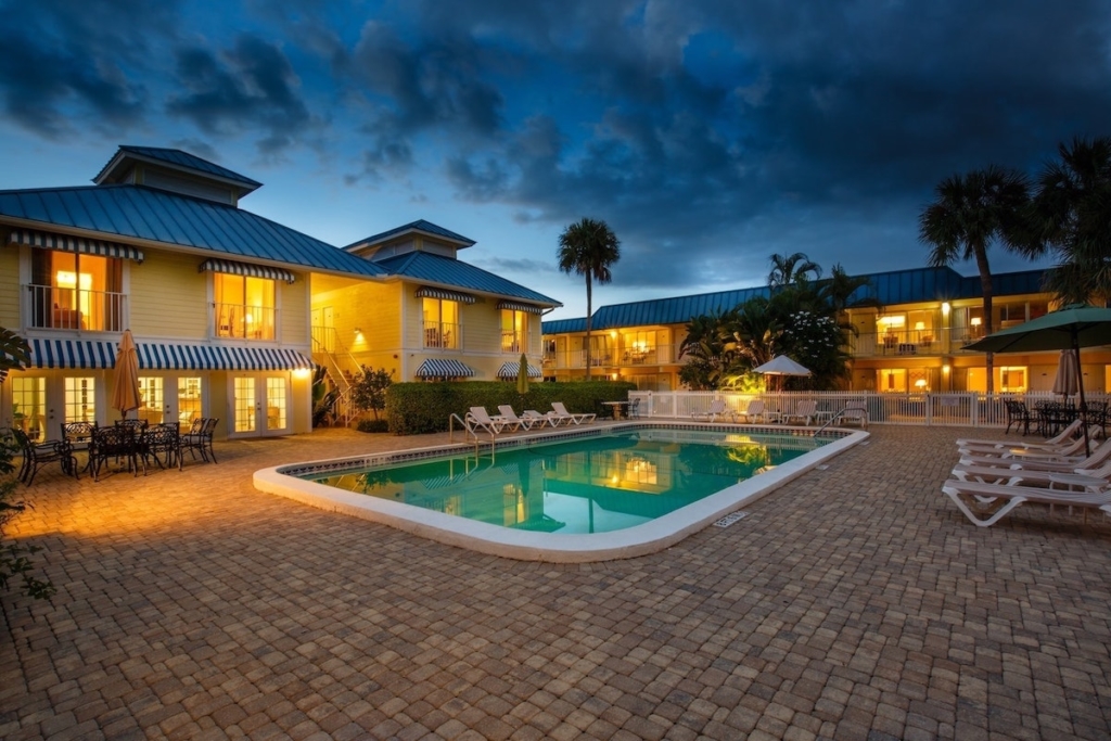The heated pool and tropical grounds at Naples Garden Inn